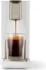 A coffee machine is brewing coffee into a glass cup. Produktbild-Vorschau