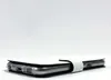 A white phone case is lying on a white surface. Produktbild-Vorschau