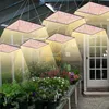 A greenhouse interior with plants on shelves and grow lights hanging above. Produktbild-Vorschau