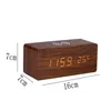 A digital alarm clock with a wooden finish and illuminated display, shown with measurement indicators. Produktbild-Vorschau