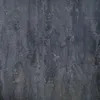 A close-up texture of a dark gray table. Produktbild-Vorschau