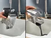Two images showing a portable spot cleaner being rinsed and emptied into a sink. Produktbild-Vorschau