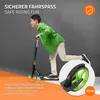A young boy is riding a scooter, with a close-up of the scooter's brake system shown in a circular inset. Náhľad obrázku produktu