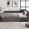 A gray upholstered daybed with bedding and pillows in a room with artwork and a large window. Anteprima dell’immagine prodotto