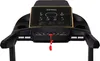 The front console of a black treadmill with a gold-trimmed LED display. Podgląd zdjęcia produktu