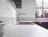 A modern kitchen sink with a faucet running water. Produktbild-Vorschau