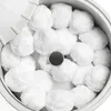 A close-up view of white filter balls inside a container. Produktbild-Vorschau