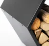 A close-up shot of a black metal firewood rack filled with logs, against a white background. Podgląd zdjęcia produktu