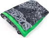 A folded costume cloak with a Celtic knot pattern and a bright green lining. Anteprima dell’immagine prodotto
