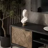 A modern media console with a decorative wooden door and a bust sculpture on top. Produktbild-Vorschau