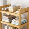 A wooden shelving unit with various bathroom items and folded clothes. Produktbild-Vorschau