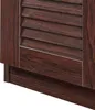 A close-up view of the bottom section of a wooden shoe cabinet with louvered doors. Voir les images du produit