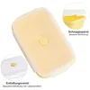 A yellow silicone food storage container with a lid, shown from a top-down perspective. Insets highlight specific features. Podgląd zdjęcia produktu