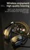 A pair of black and gold wireless headphones is displayed on a dark, textured background, with a smartphone showing a picture of two people visible underneath. Produktbild-Vorschau