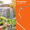 A greenhouse in a garden with a metal clip in the foreground. Produktbild-Vorschau