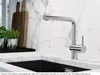 A modern kitchen sink area with a faucet, marble countertop, and backsplash. Produktbild-Vorschau