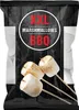 A bag of XXL marshmallows for BBQ, with three marshmallows on skewers in the foreground. Náhled obrázku produktu