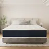 A mattress is displayed on a bed frame in a bedroom setting. Produktbild-Vorschau