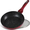 A frying pan with a red handle and a speckled black interior, placed on a white background with a glass lid partially visible. Podgląd zdjęcia produktu