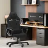 A gaming setup with a chair, desk, monitors, and computer. Produktbild-Vorschau