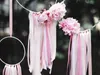 Close-up of decorative elements with pink flowers and ribbons. Náhled obrázku produktu