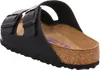 A close-up view of a black Birkenstock sandal, showing the cork footbed and adjustable straps. Anteprima dell’immagine prodotto