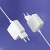 Two white USB-C power adapters with cables against a blue background. Podgląd zdjęcia produktu