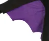 A close-up view of a black fabric with a purple fabric underneath, shaped like bat wings. Náhľad obrázku produktu