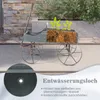 A decorative wooden wagon planter filled with soil and small plants, shown outdoors on a patio. Voir les images du produit