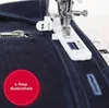 A close-up of a sewing machine foot creating a buttonhole on dark denim fabric. Anteprima dell’immagine prodotto
