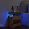A bedside table with LED lighting next to a bed. Anteprima dell’immagine prodotto