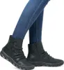 A pair of dark green Rieker women's ankle boots with decorative buttons and a zipper, worn with blue jeans. Náhled obrázku produktu