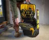A person is holding open a tool backpack, revealing its contents. Voir les images du produit