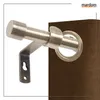 A close-up of a curtain rod and bracket attached to a brown curtain. Produktbild-Vorschau