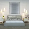 A modern bedroom with a bed, nightstands, and a window with blinds. Produktbild-Vorschau