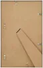 The back of a white picture frame with a brown cardboard backing and a stand attached. Náhľad obrázku produktu