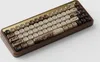 A close-up, angled view of a mechanical keyboard with a wooden case and decorative keycaps. Produktbild-Vorschau