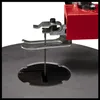 A close-up view of the blade and table of a scroll saw. Produktbild-Vorschau