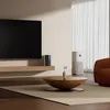 A modern living room with a TV, air purifier, and coffee table. Náhľad obrázku produktu