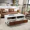 A living room scene with a couch, coffee table, and lamp. Produktbild-Vorschau
