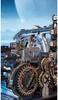 Close-up view of a complex wooden mechanical model with gears and tracks, set against a futuristic or space-themed background. Podgląd zdjęcia produktu