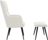 A cream-colored armchair and ottoman with black legs are shown against a white background. Náhled obrázku produktu