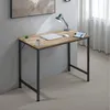 A desk with a laptop, mouse, lamp, and coffee cup. Náhled obrázku produktu