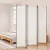 A white room divider is set up in a bedroom next to a bed. Podgląd zdjęcia produktu