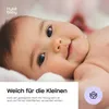 A close-up of a baby's face with text overlays and a logo. Produktbild-Vorschau