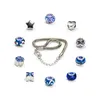 A collection of charms and a bracelet arranged in a circle around the bracelet on a white background. Produktbild-Vorschau