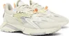 A pair of cream-colored Lacoste sneakers on a white background. Produktbild-Vorschau