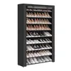 A tall, black, multi-shelf shoe rack filled with various types of shoes. Produktbild-Vorschau