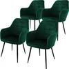 Four dark green velvet dining chairs with black metal legs are arranged on a white background. Náhľad obrázku produktu