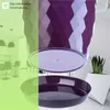 A split image showing a modern kitchen on the left and a close-up of a purple planter with a geometric design on the right. Podgląd zdjęcia produktu